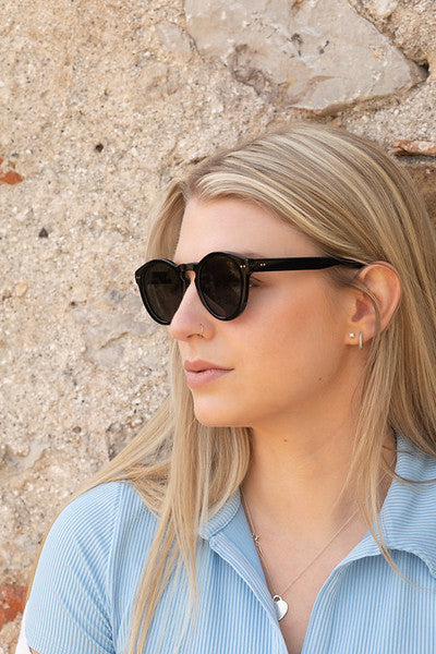 Woman in profile wearing Savona sunglasses with black frame